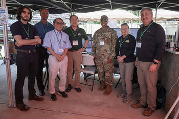 Pictured from left to right: Dyar Aziz, Rajesh Ganesan, Kuo-Chu "KC" Chang, Michael Hieb, Lieutenant Colonel Charles "Chaz" LeDeatte, Sherry Crissman, Alexander Brodsky.
